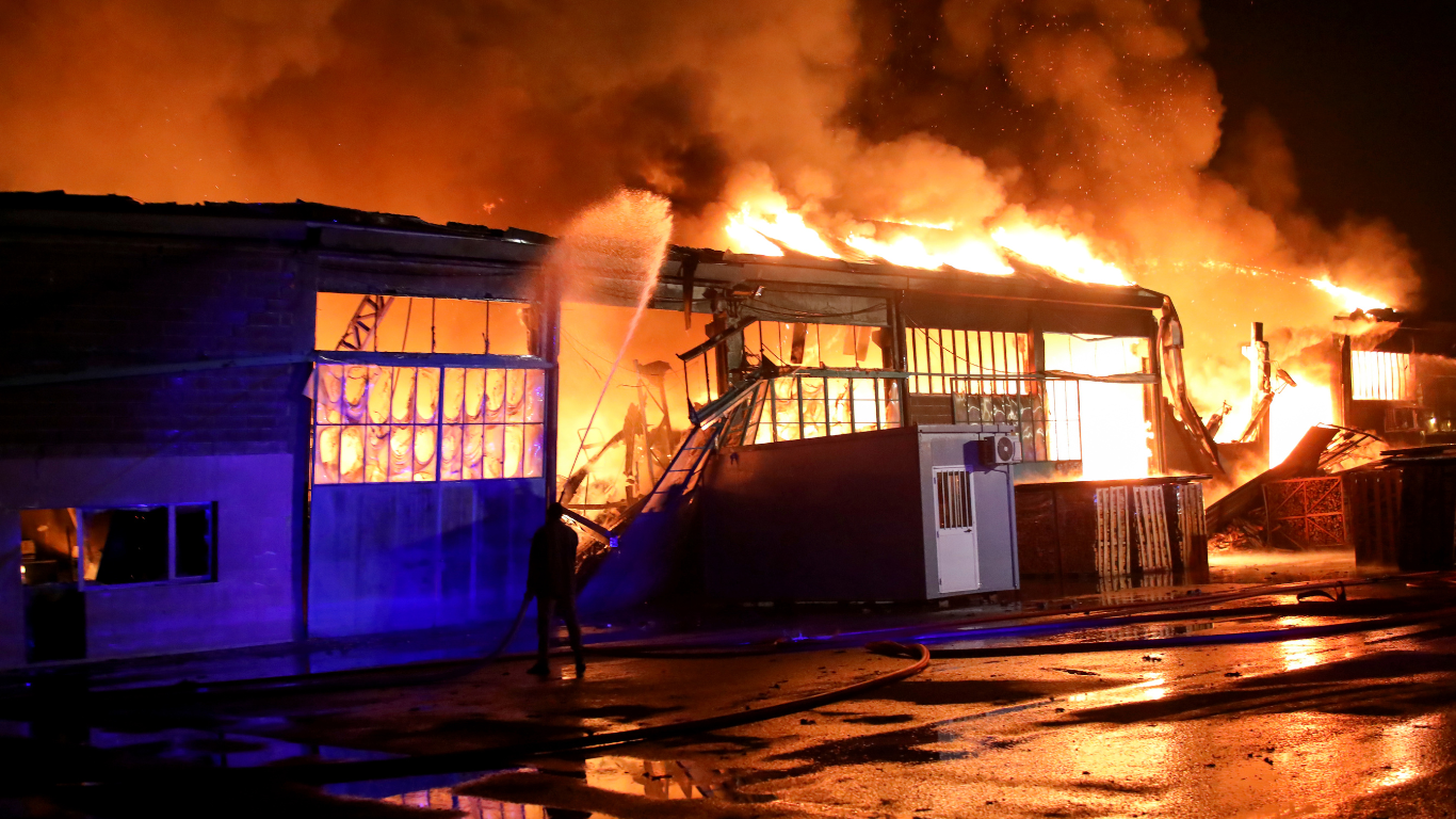 Semiconductor plant engulfed in flames during a factory fire in Japan.